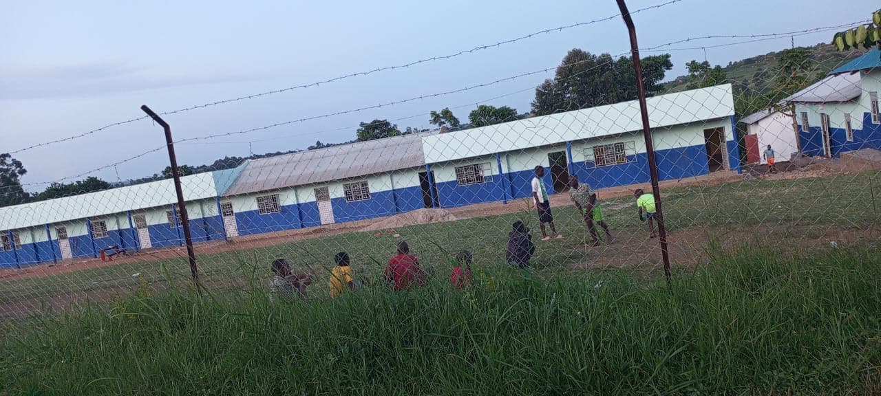Community members outside the school classroom block