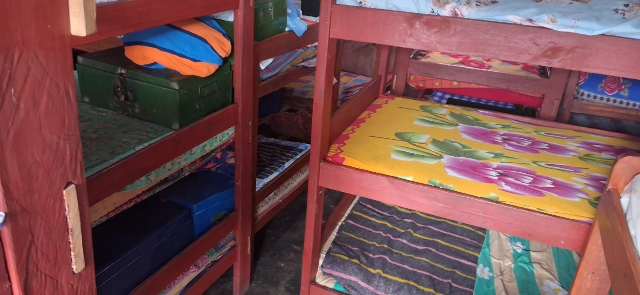 Full rows of bunk beds inside a St. Mary's dormitory