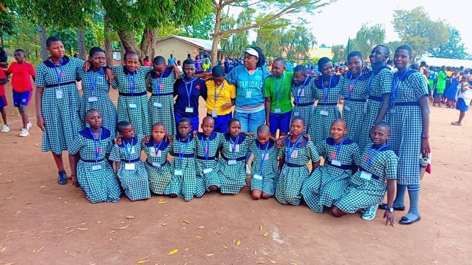 Pupils gathered together under the trees