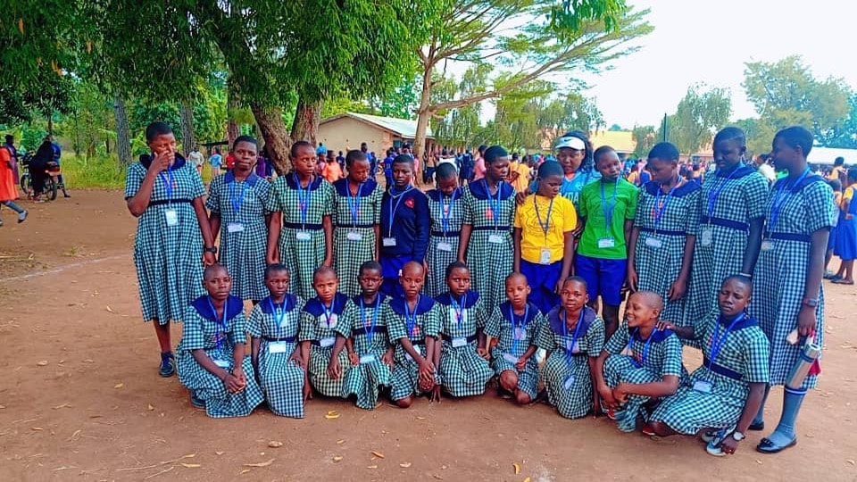 Pupils gathered together under the trees