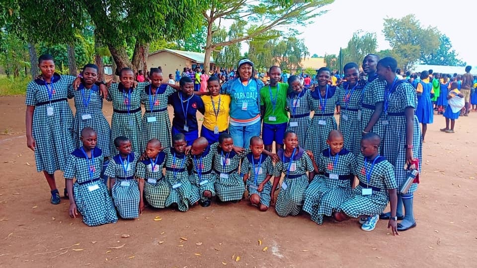 Pupils posing together on the school grounds