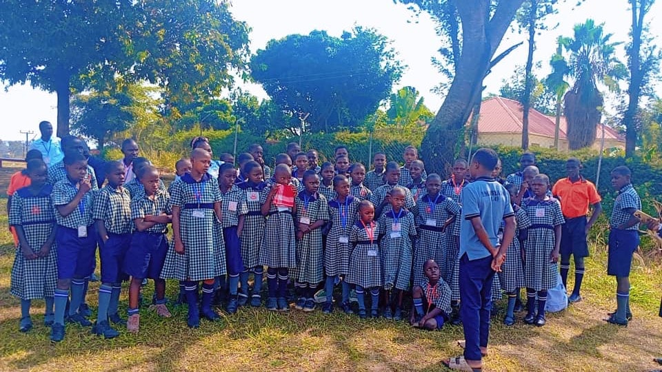 Pupils lined up together on the school grounds