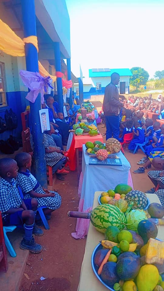 A display of fruits and vegetables at a school nutrition event