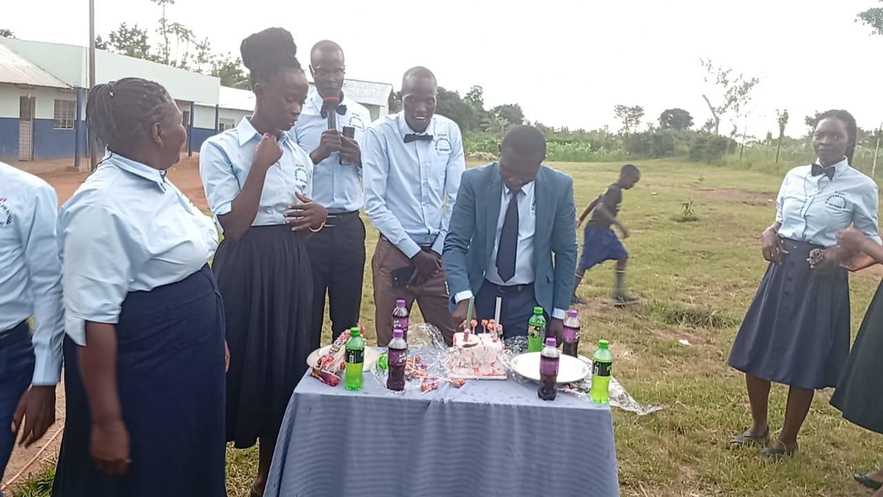 Staff celebrating a special occasion on the school field