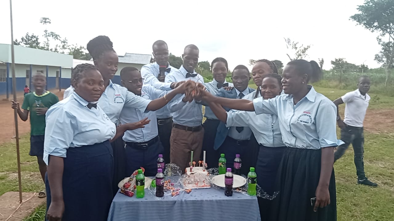 St. Mary's staff celebrating together on the school grounds