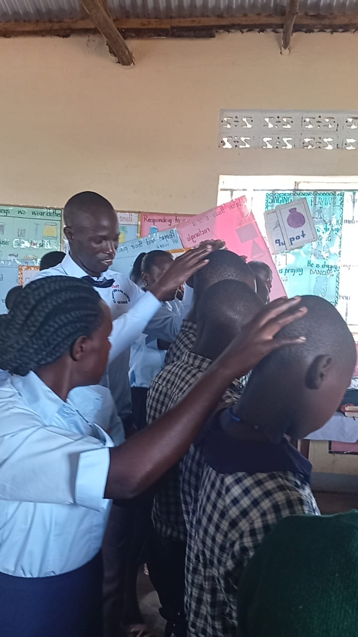 A teacher with pupils inside a St. Mary's classroom